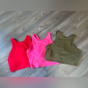 Athleta conscious crop size large 3-pack 
Hot pink, red, and olive green